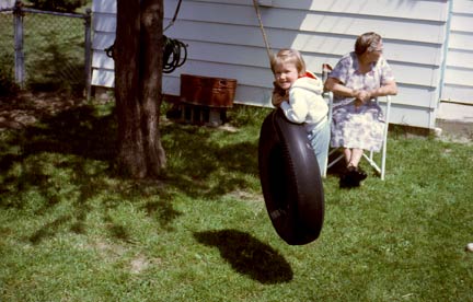 Laura swinging with Grandma Gordon